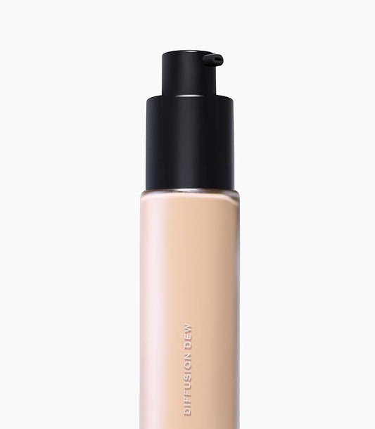 MAKE Beauty Diffusion Dew Skin Tint. Sheer to Medium Coverage Radiant Finish. Blurring, Smoothing, and Brightening for Glowing Complexion. Enhanced with Niacinamide and Adenosine. Neutral 02