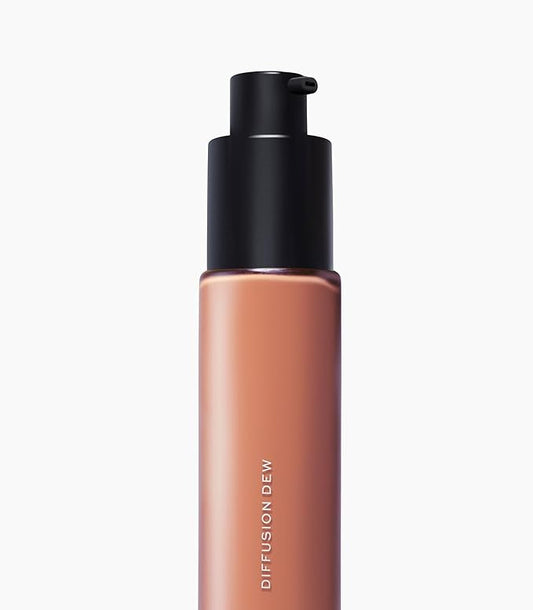 MAKE Beauty Diffusion Dew Skin Tint. Sheer to Medium Coverage Radiant Finish. Blurring, Smoothing, and Brightening for Glowing Complexion. Enhanced with Niacinamide and Adenosine. Hazelnut 16
